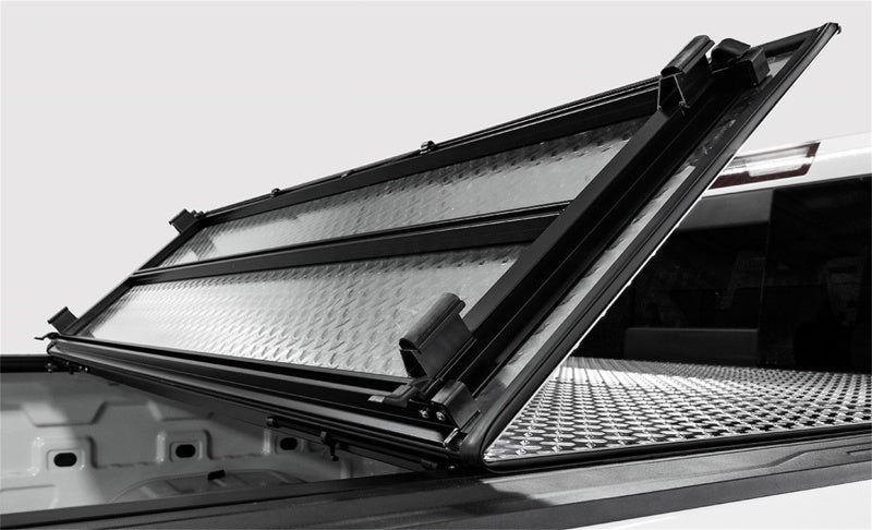 Access LOMAX Tri-Fold Cover Black Urethane Finish - 2016-2024 Nissan Titan 5ft 6in Bed